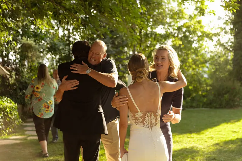 Father of the bride embracing his daughter
